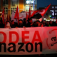 People shouts slogans during a strike in Torrejon Ardoz, Spain, Friday, Nov. 23, 2018.